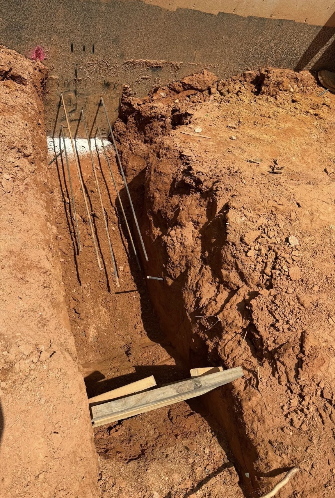 Detailed excavation trench beside a foundation