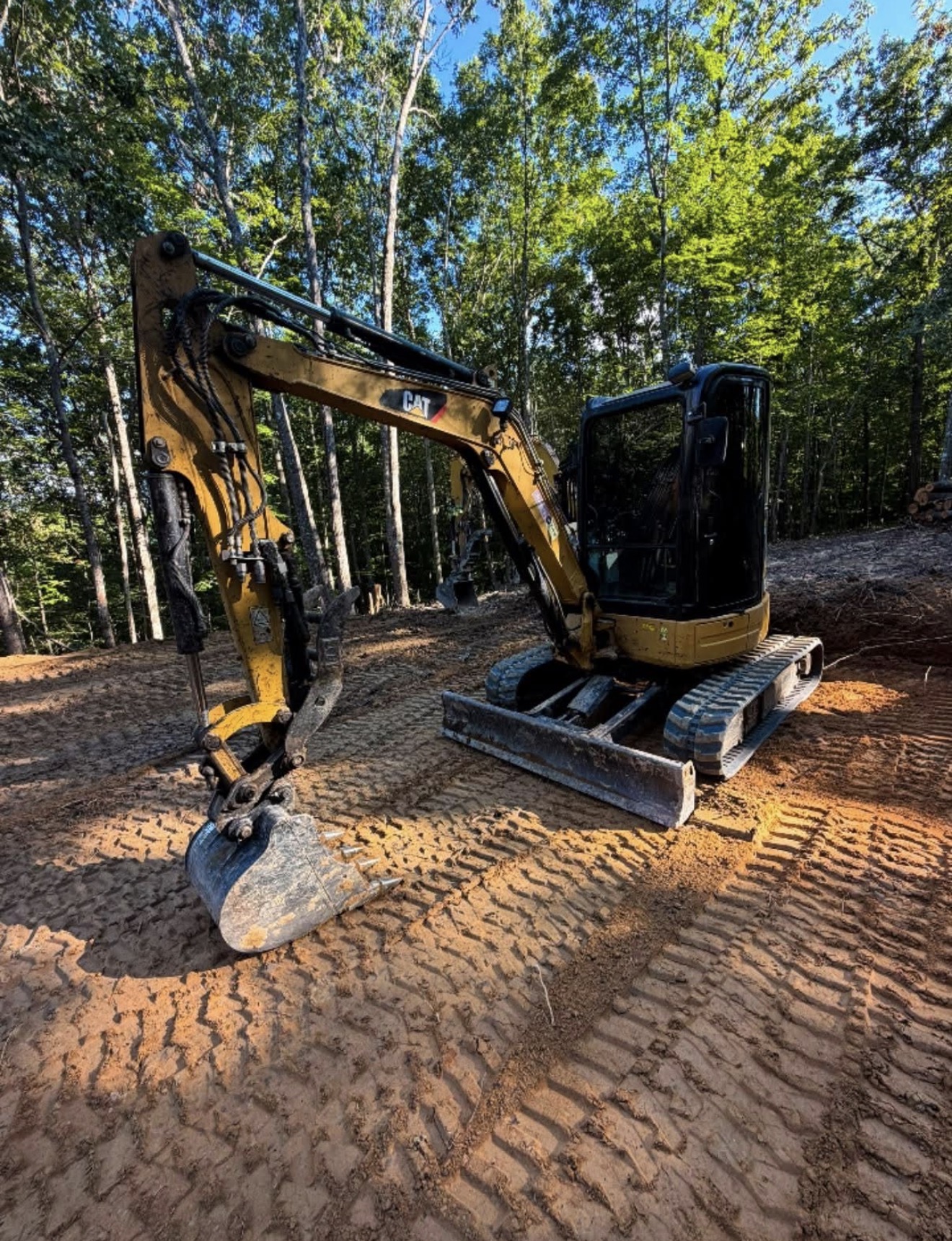 Excavator working on prepared earth
